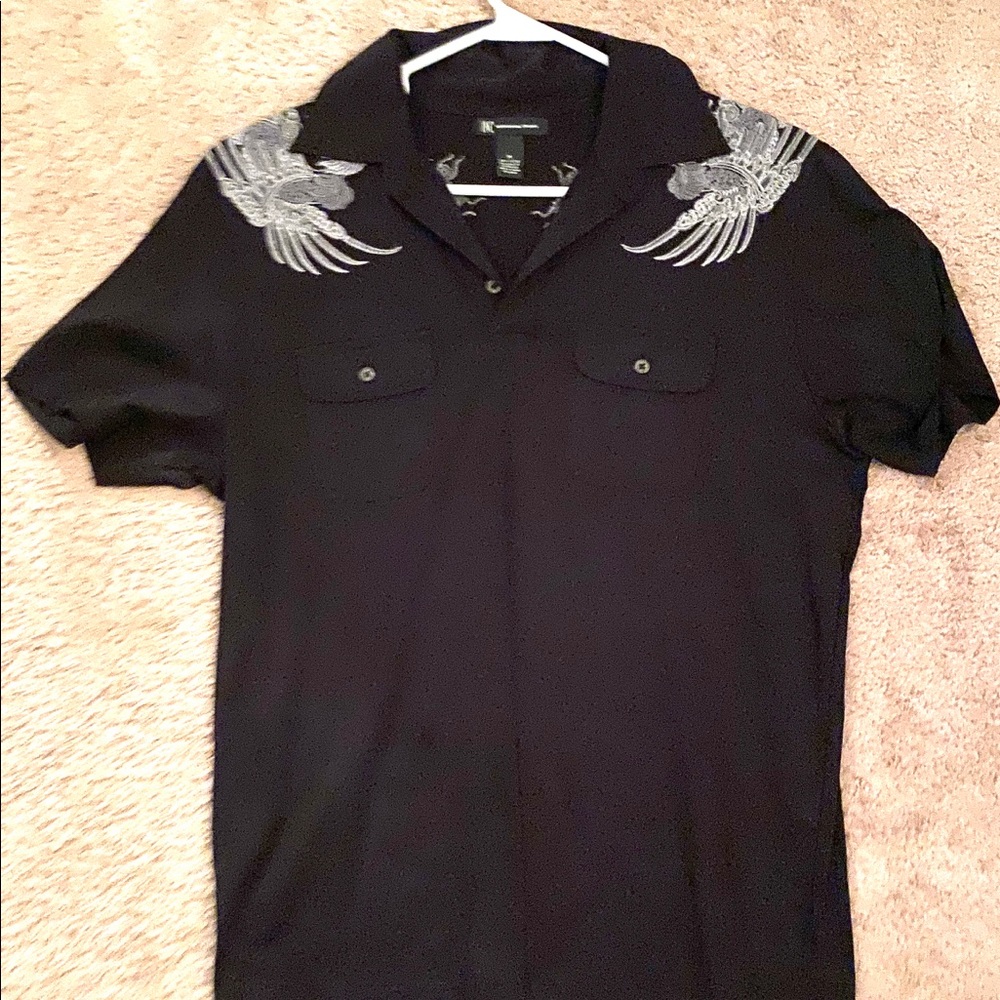 Men’s Inc polo with embroidered design.